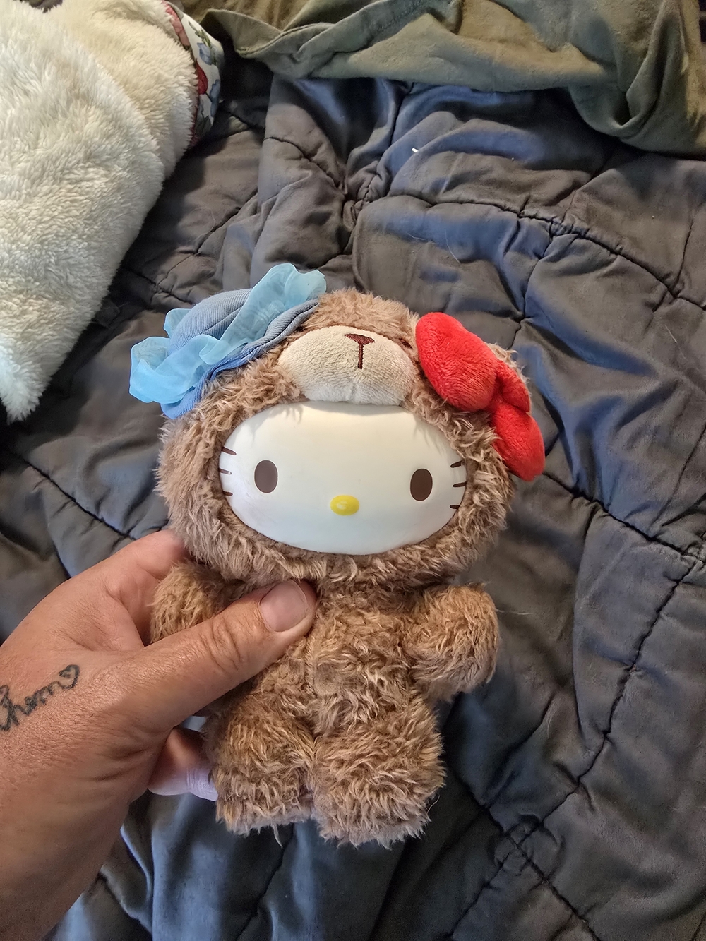 Hello Kitty Plush in Brown with Red Bow and Blue Flower